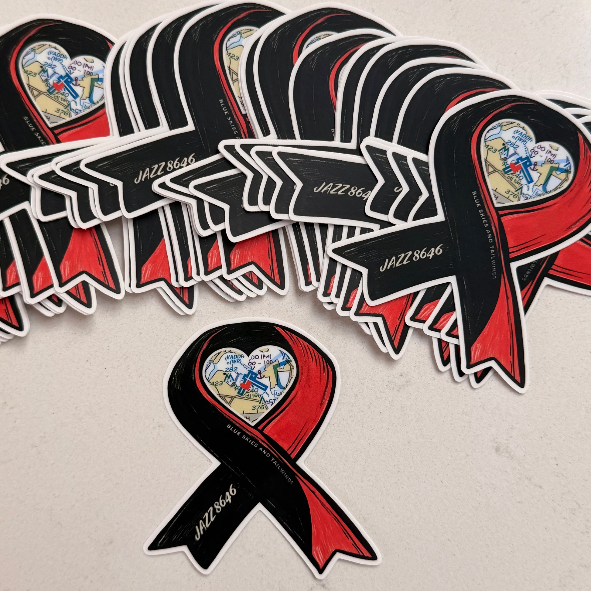 Red and black ribbon stickers with 'JAZZ8646' text on a light gray background